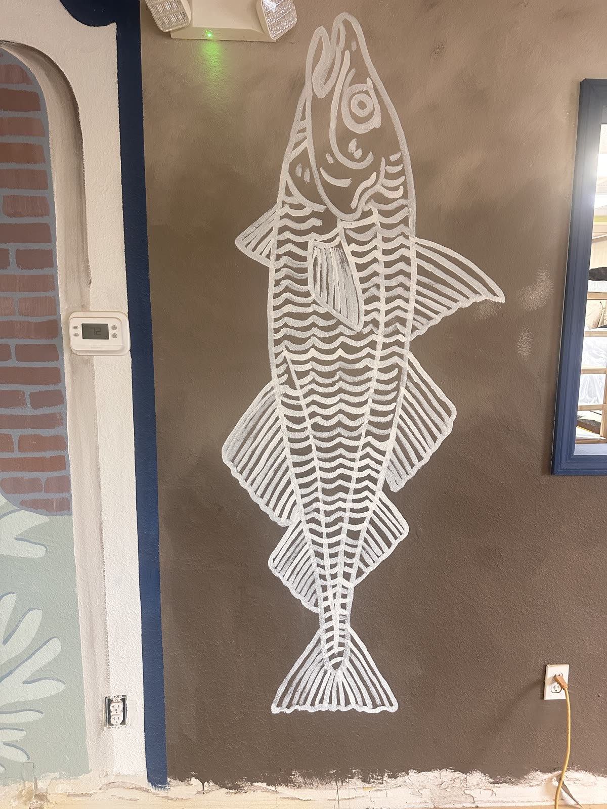 Large hand-painted fish mural